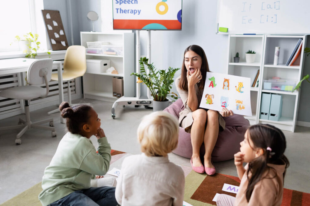 ABA therapy: a therapist leading a small group of children