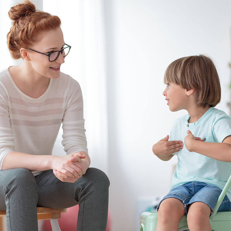 Counseling: a counselor talking with a young boy