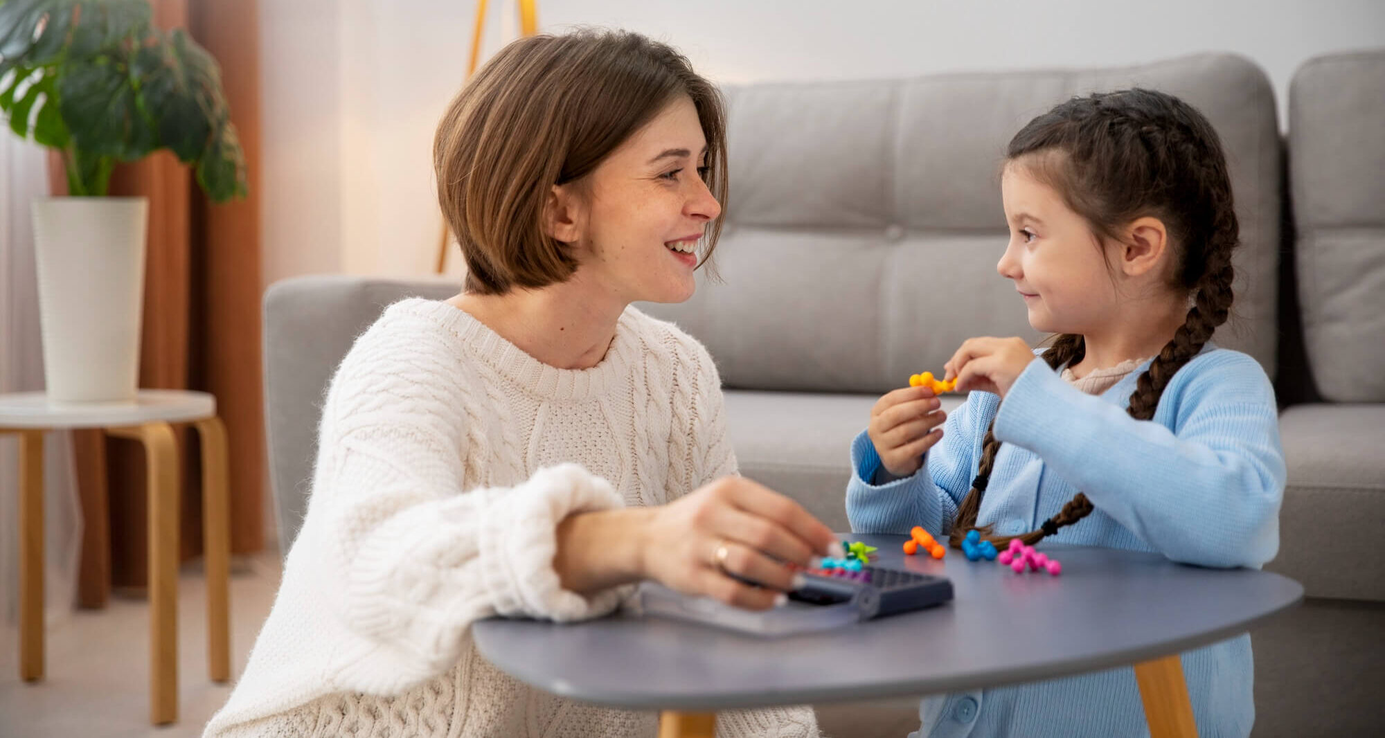 Therapist playing a game with two girls