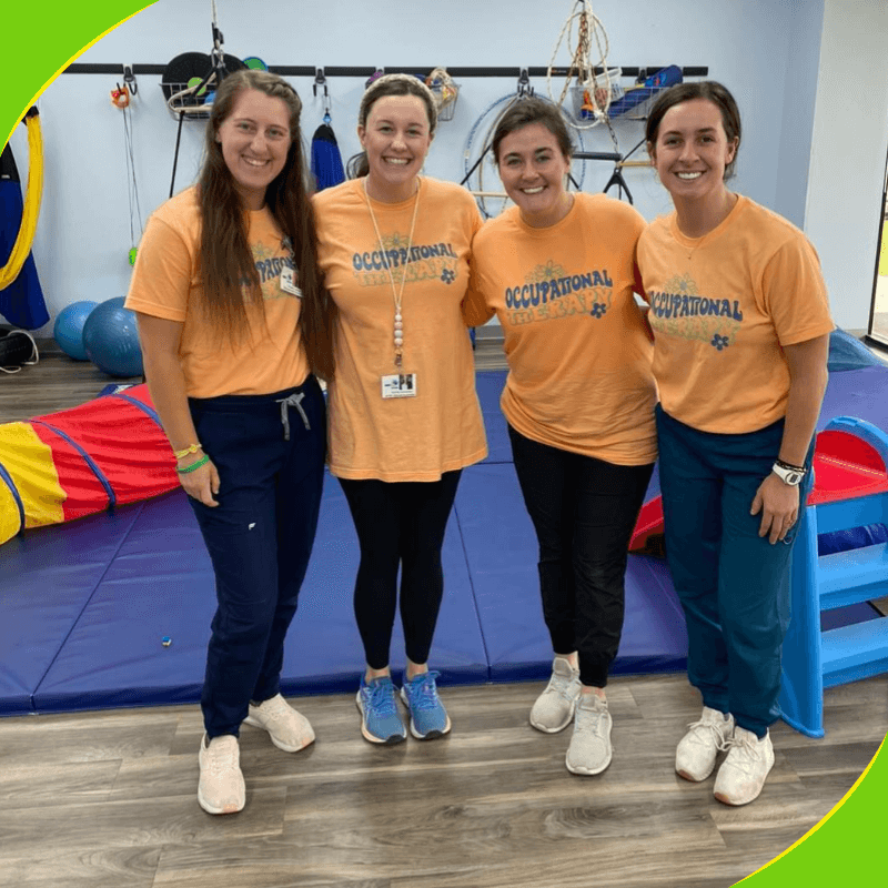 Four therapists in a therapy gym