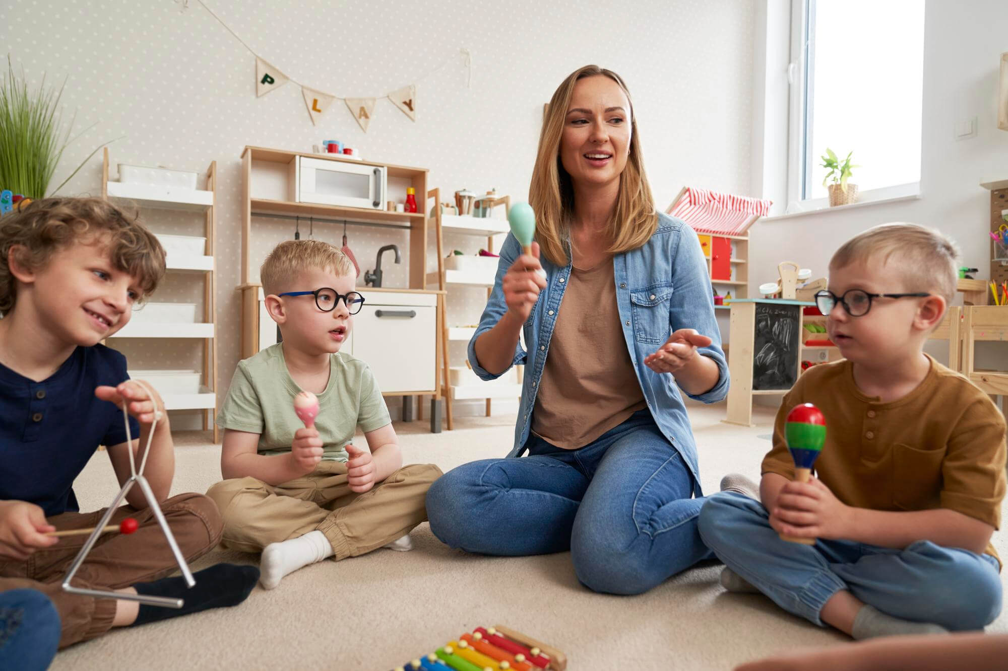 Therapist playing instruments with a group of children